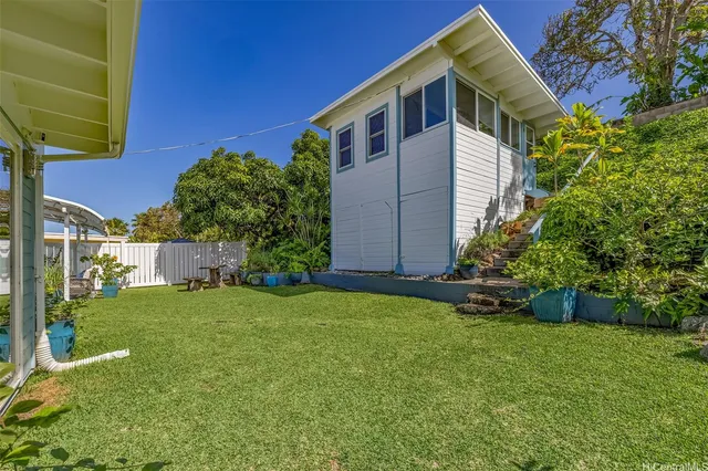 a room with a table chairs and a view of living room