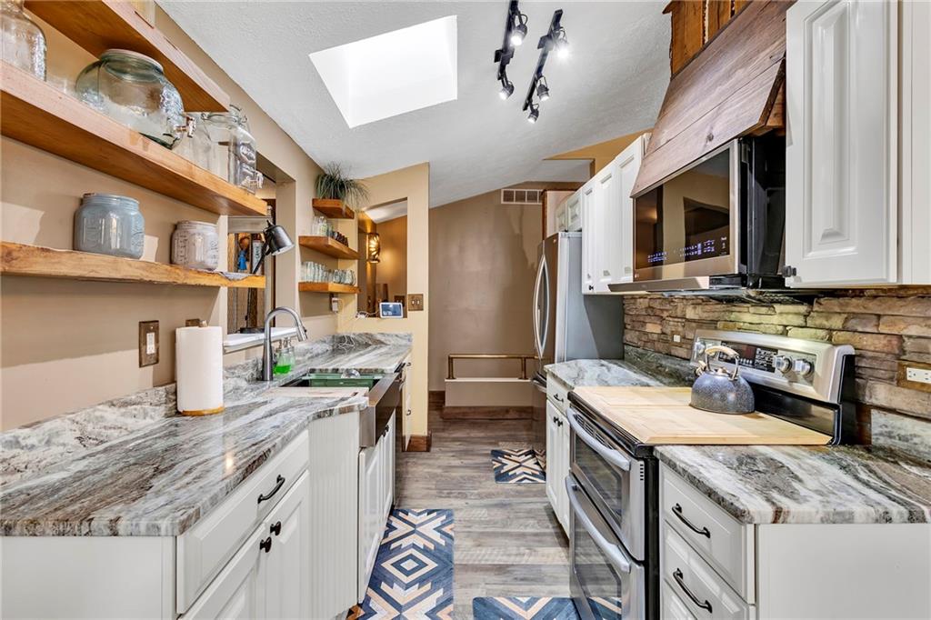 1233 Old Concord Road Monroeville, PA 15146 - Photo 15 of 40 a kitchen with a sink stove and refrigerator