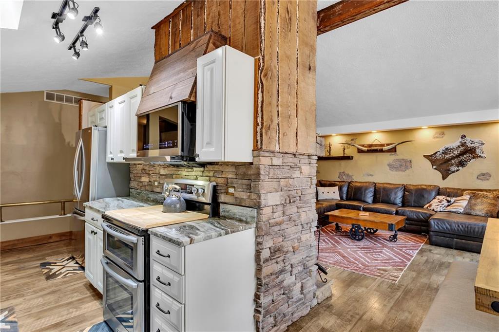1233 Old Concord Road Monroeville, PA 15146 - Photo 16 of 40 a utility room with stainless steel appliances kitchen island granite countertop a stove and a refrigerator