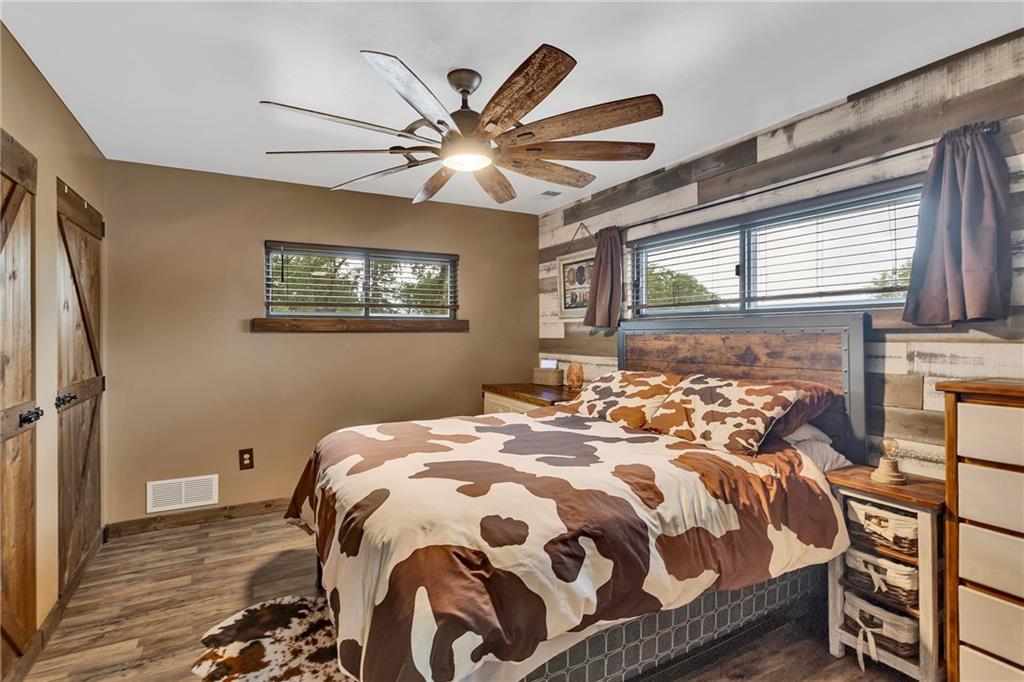 1233 Old Concord Road Monroeville, PA 15146 - Photo 17 of 40 a bedroom with a bed and a chandelier