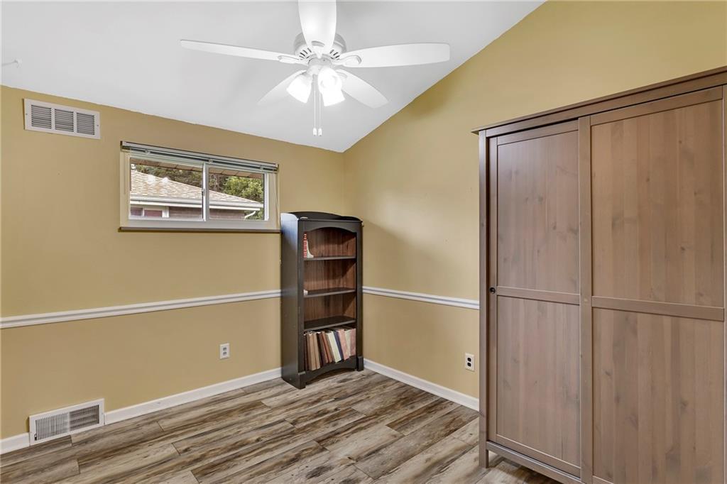 1233 Old Concord Road Monroeville, PA 15146 - Photo 27 of 40 a view of empty room with wooden floor and fan