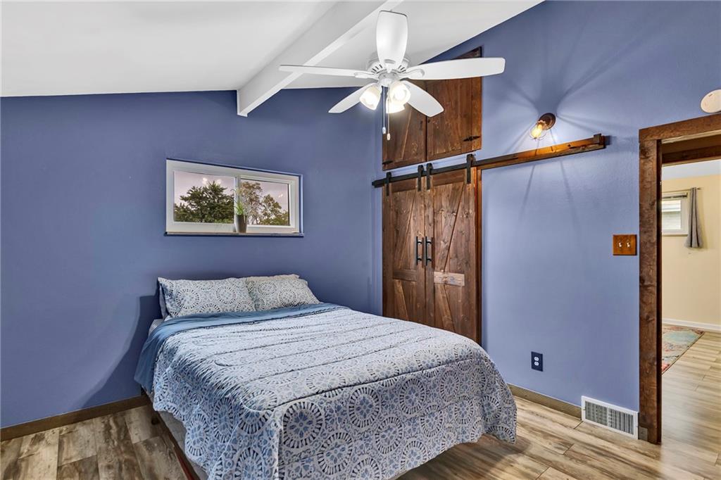 1233 Old Concord Road Monroeville, PA 15146 - Photo 30 of 40 a bedroom with a bed and a chandelier