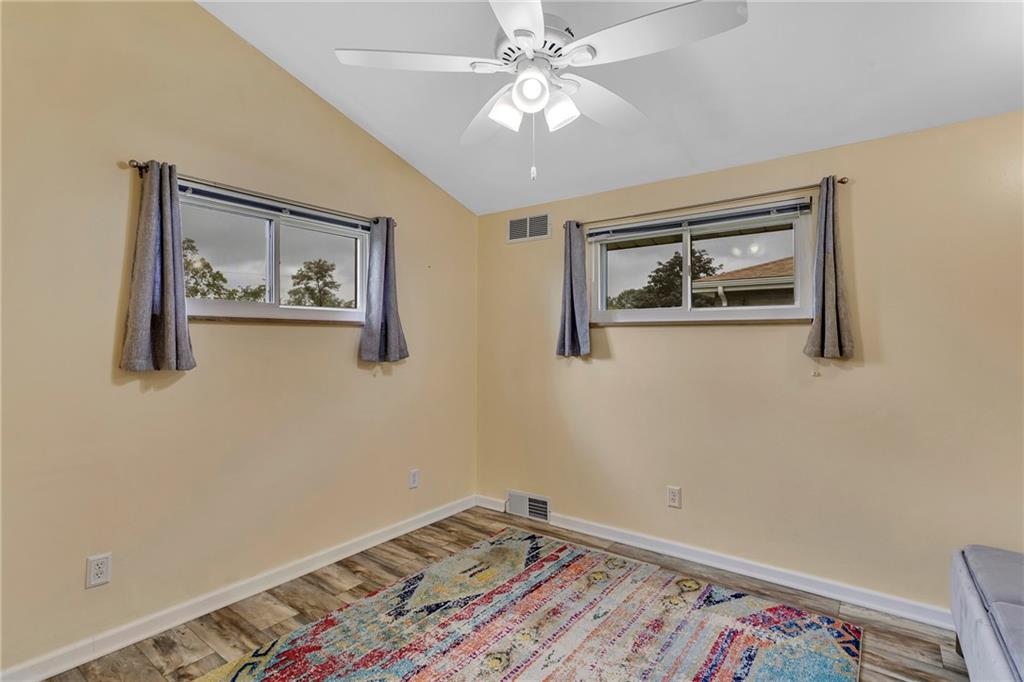 1233 Old Concord Road Monroeville, PA 15146 - Photo 33 of 40 a room with painting on the wall and a window