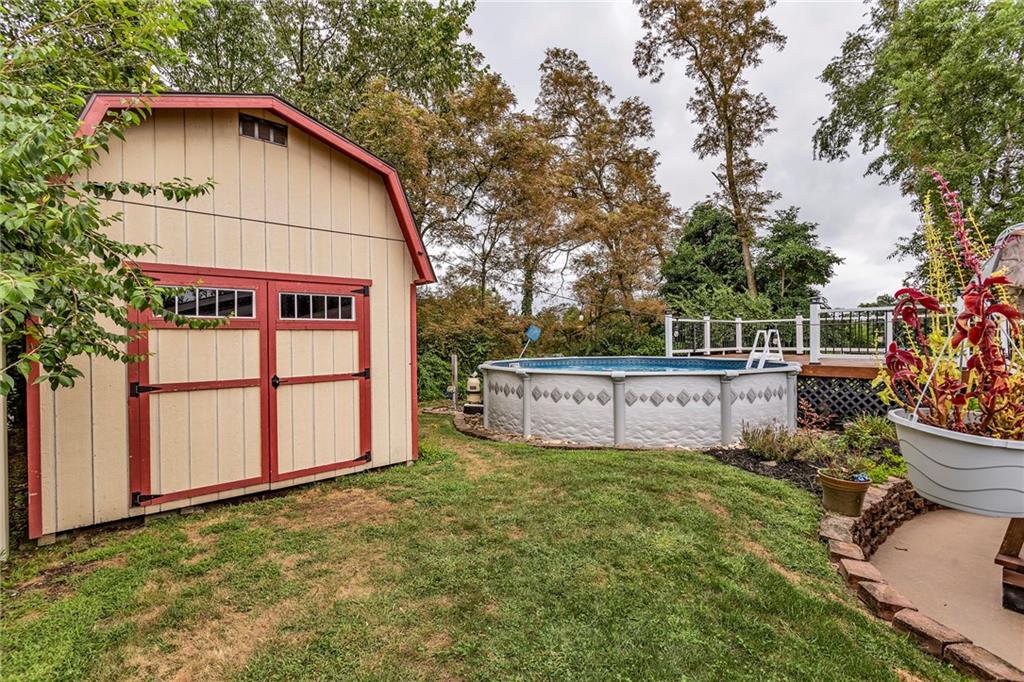 1233 Old Concord Road Monroeville, PA 15146 - Photo 9 of 40 a view of backyard with potted plants and a large tree