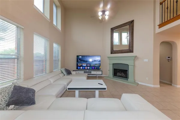 a living room with furniture and a fireplace