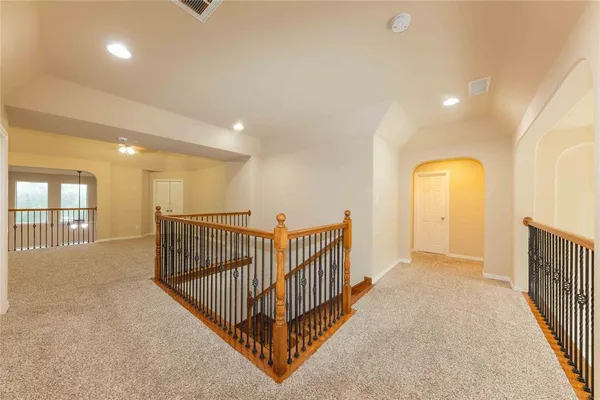 a view of a hallway with windows