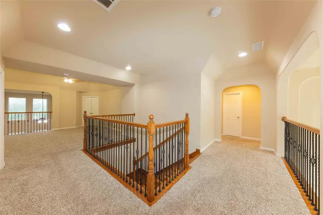 a view of a hallway with windows