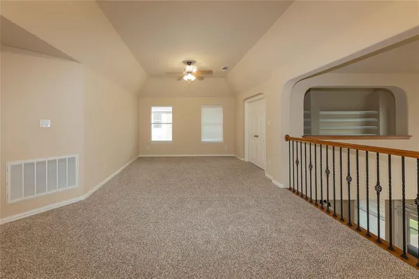 a view of a hallway with windows
