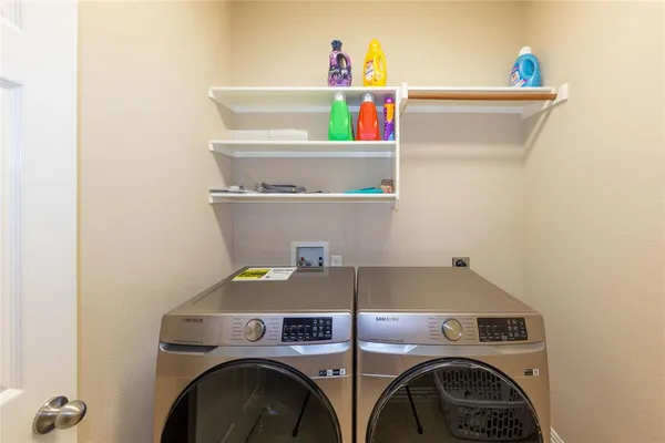 a utility room with dryer and washer
