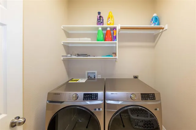 a utility room with dryer and washer