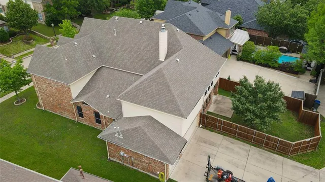 an aerial view of house with yard