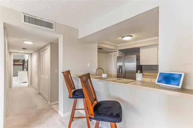 a kitchen with stainless steel appliances granite countertop a sink stove oven a sink with dishwasher and cabinets