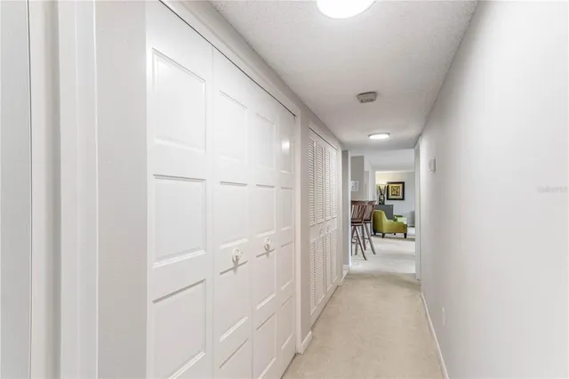 a view of a workspace with furniture and a flat screen tv