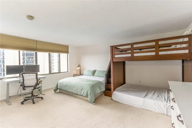 a bathroom with a granite countertop shower and a sink