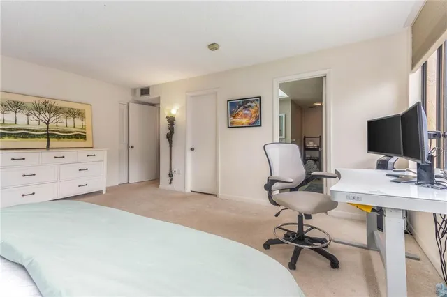 a lobby with furniture and floor to ceiling window