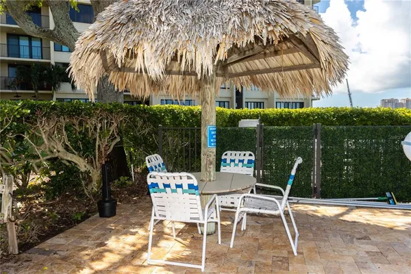 a view of a swimming pool with a patio