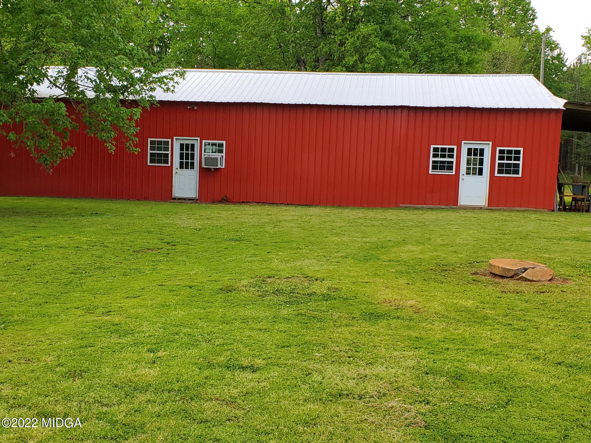 9934 Estes Road Macon, GA 31220 - Photo 19 of 26 a view of a backyard with a garden