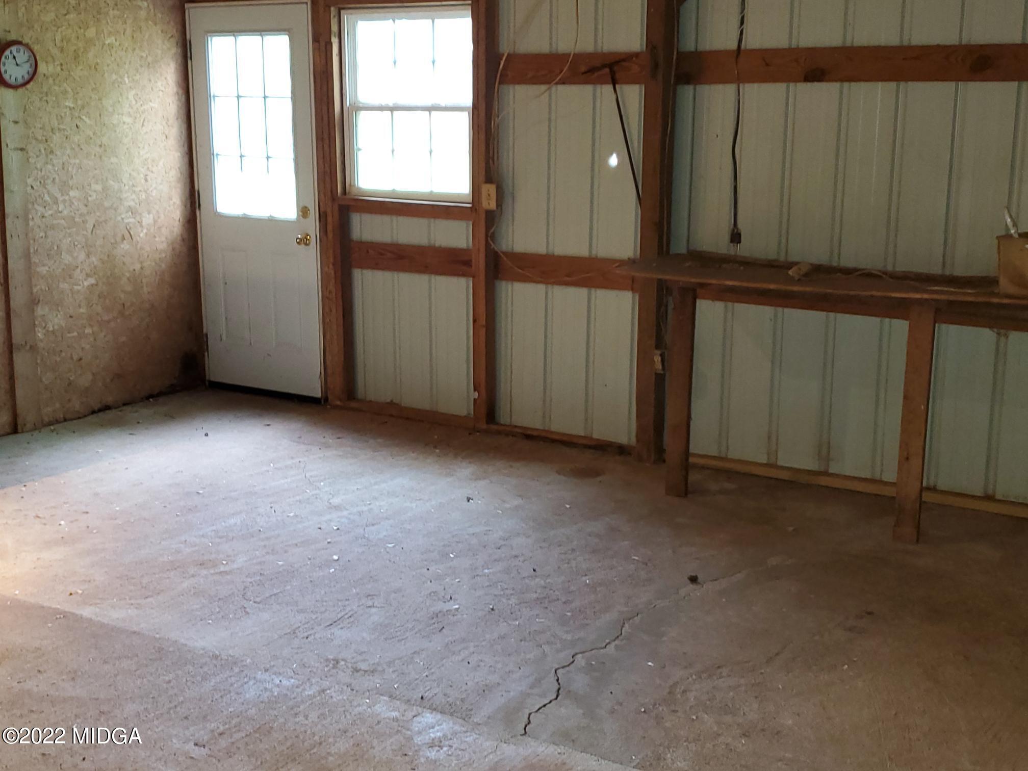 9934 Estes Road Macon, GA 31220 - Photo 22 of 26 an empty room with windows