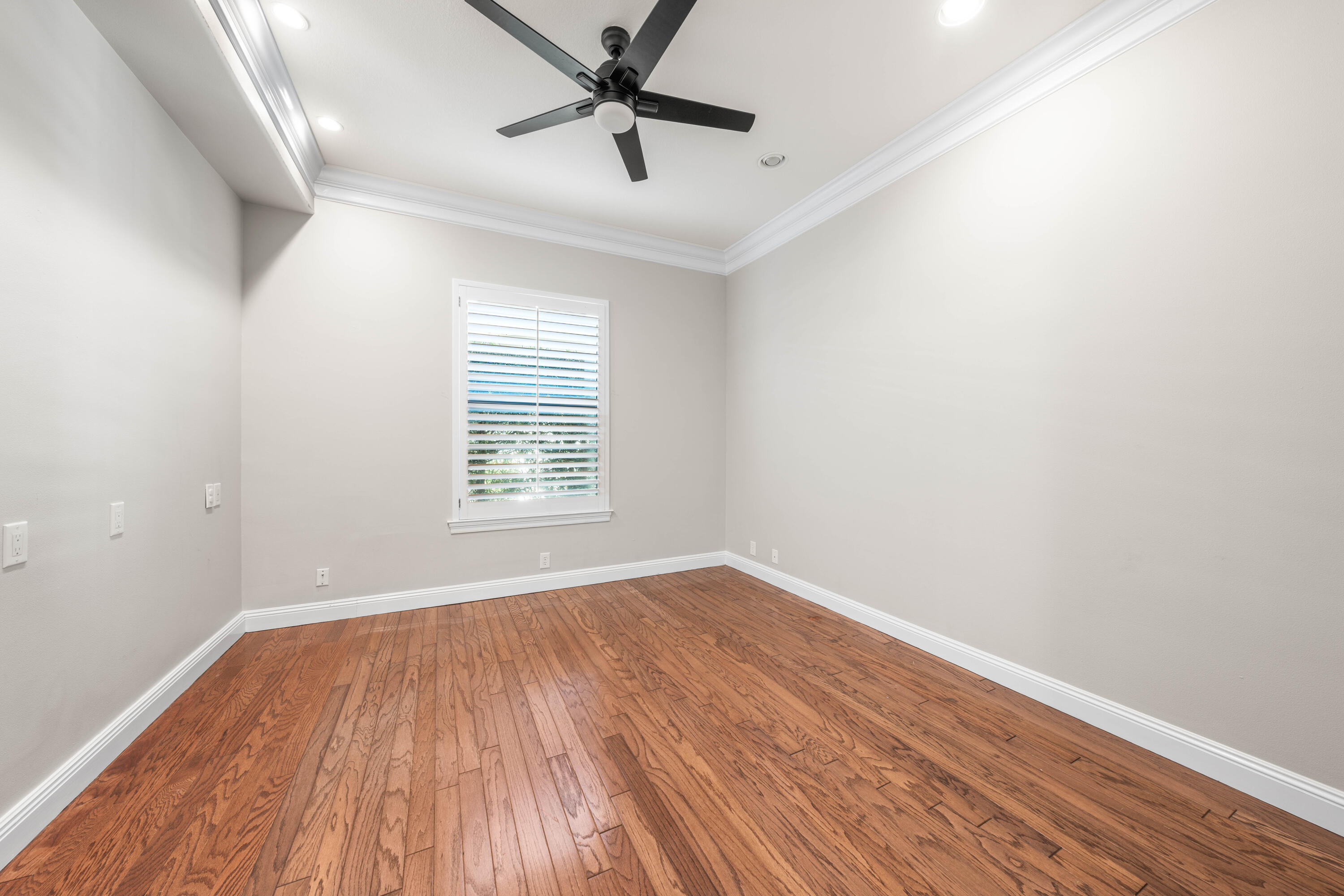 4345 Carriage Lane Destin, FL 32541 - Photo 17 of 39 wooden floor in an empty room with a window