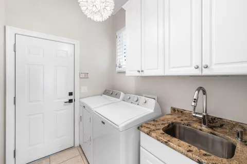 a view of a kitchen sink and cabinets
