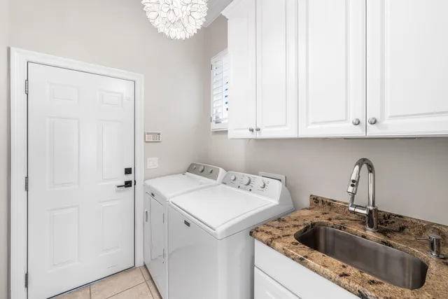 a view of a kitchen sink and cabinets