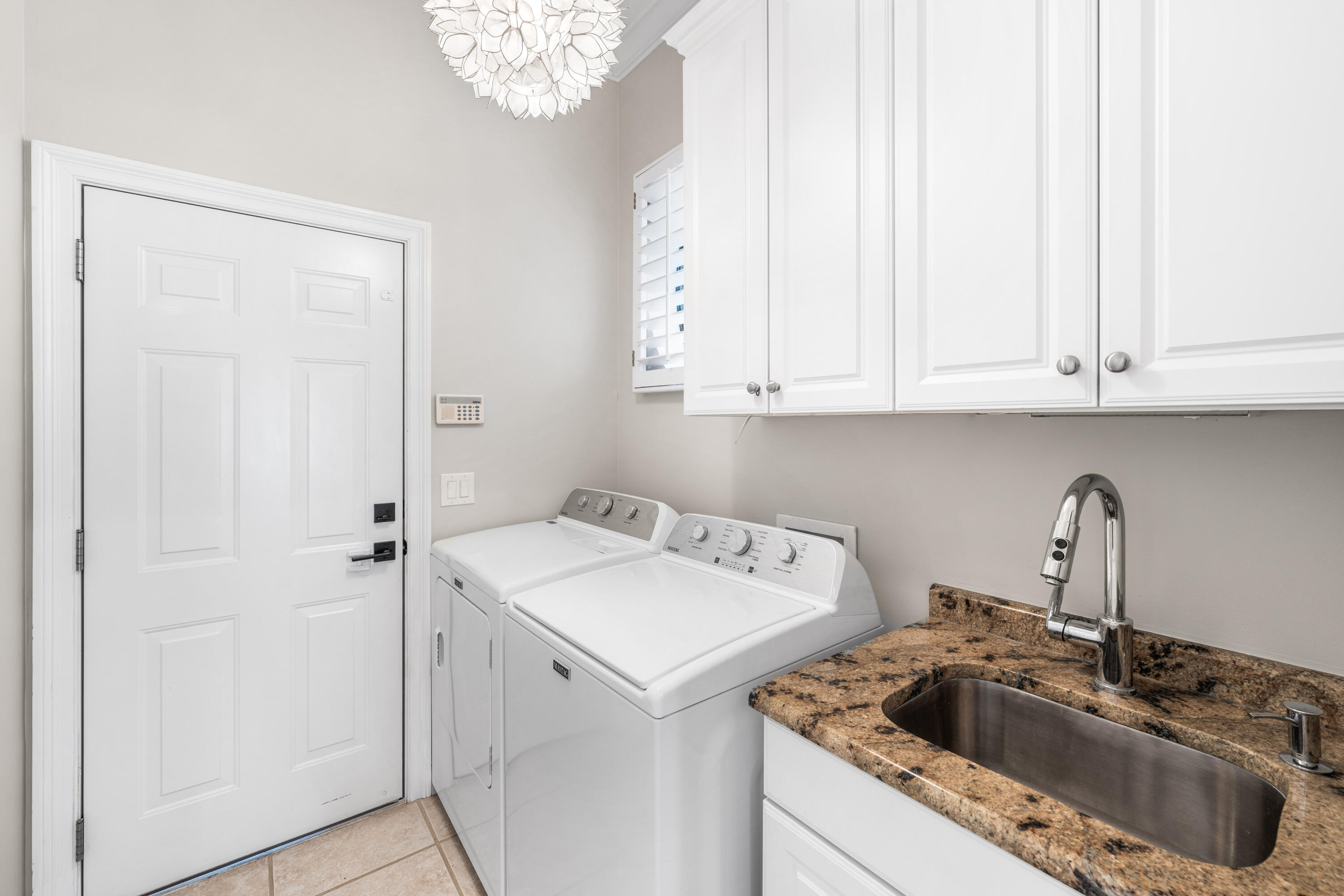4345 Carriage Lane Destin, FL 32541 - Photo 20 of 39 a view of a kitchen sink and cabinets