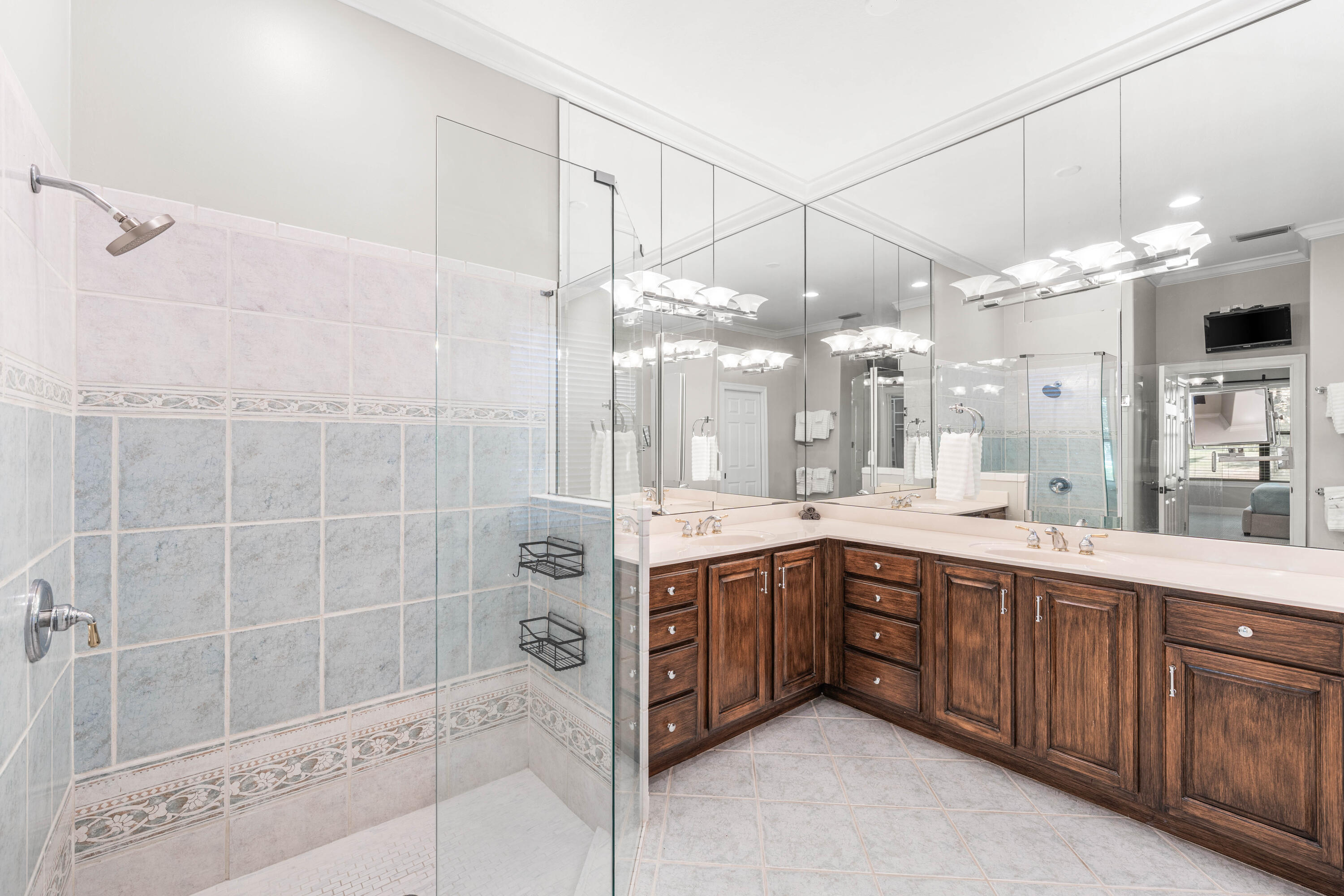 4345 Carriage Lane Destin, FL 32541 - Photo 23 of 39 a bathroom with a double vanity sink mirror and shower