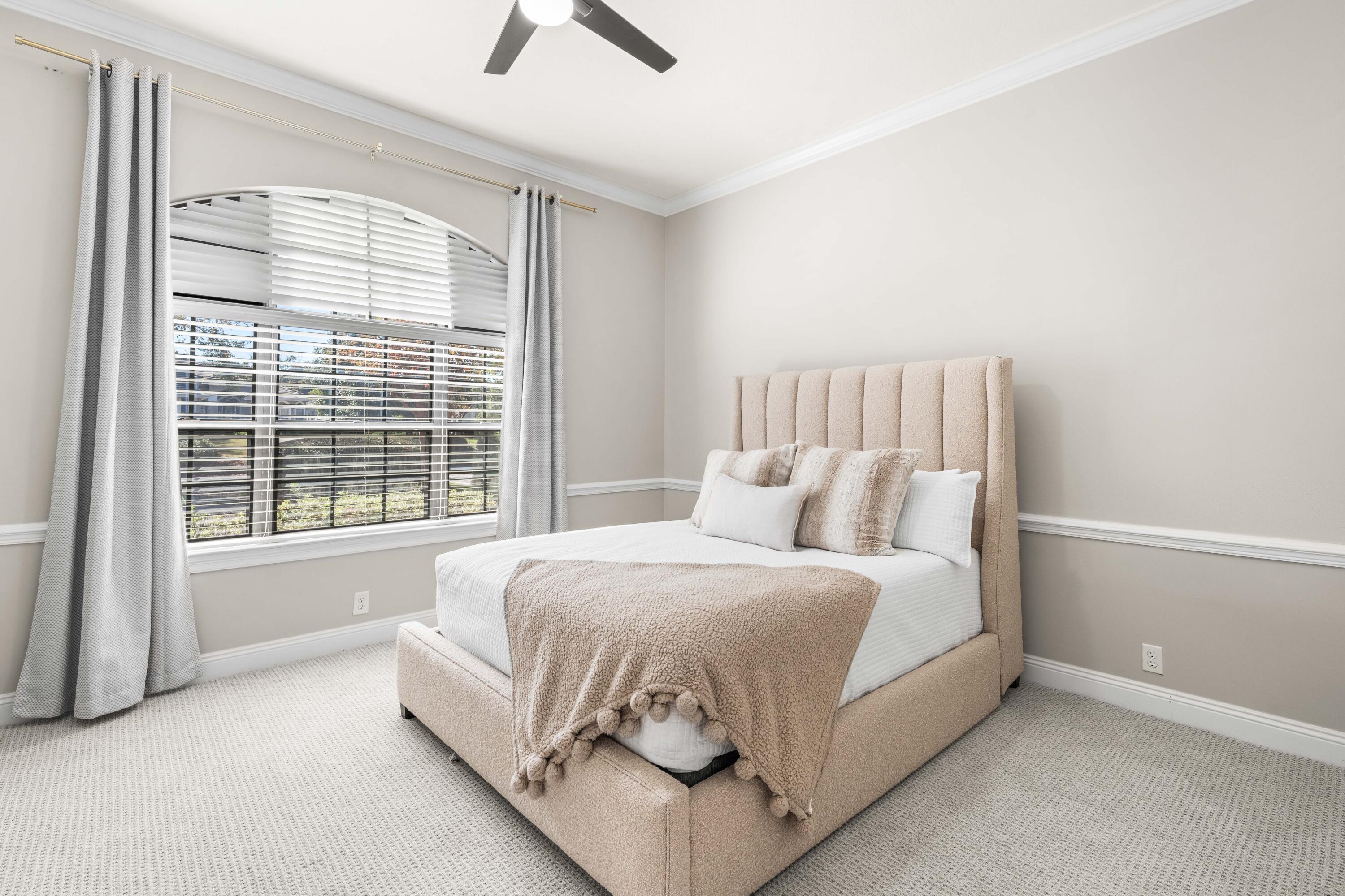 4345 Carriage Lane Destin, FL 32541 - Photo 26 of 39 a large bed sitting in a bedroom next to a window