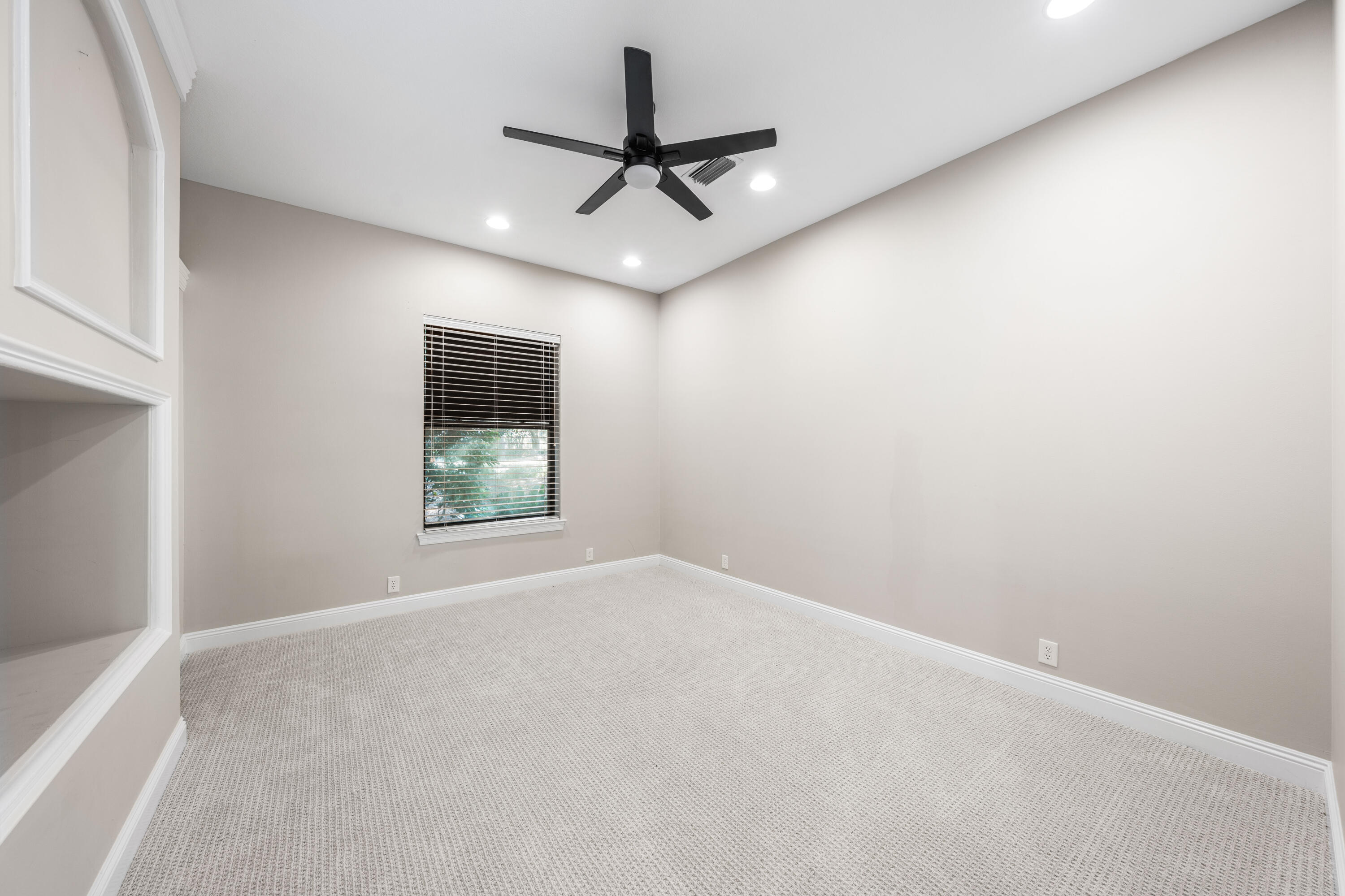 4345 Carriage Lane Destin, FL 32541 - Photo 29 of 39 an empty room with a ceiling fan and window