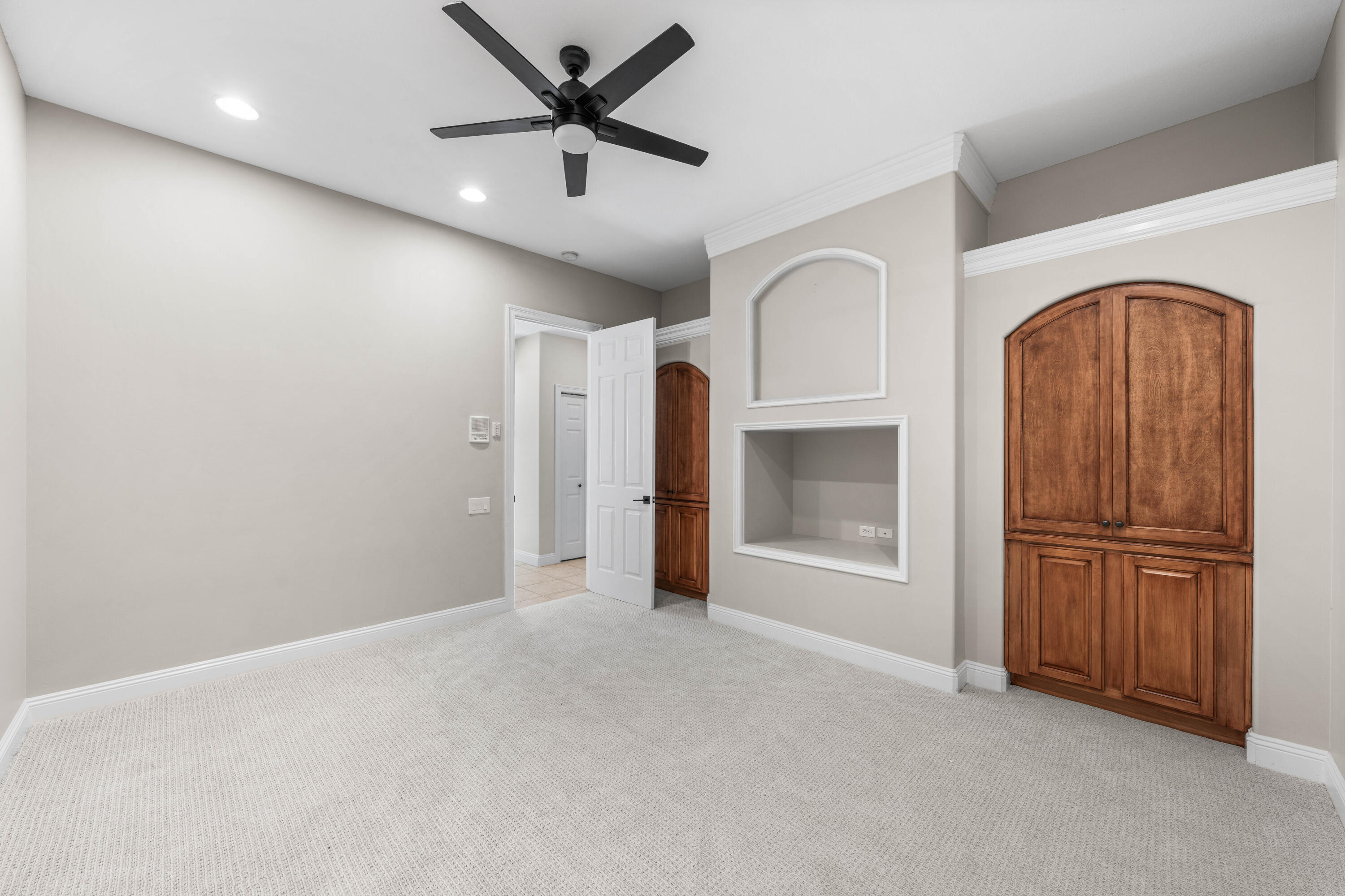 4345 Carriage Lane Destin, FL 32541 - Photo 30 of 39 an empty room with closet and a ceiling fan