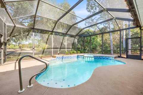 a view of a swimming pool with a patio