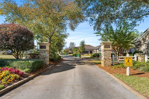 a view of a street with houses a street and trees