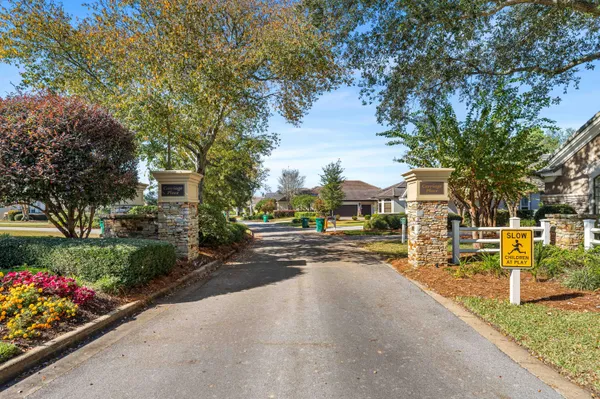 a view of a street with houses a street and trees