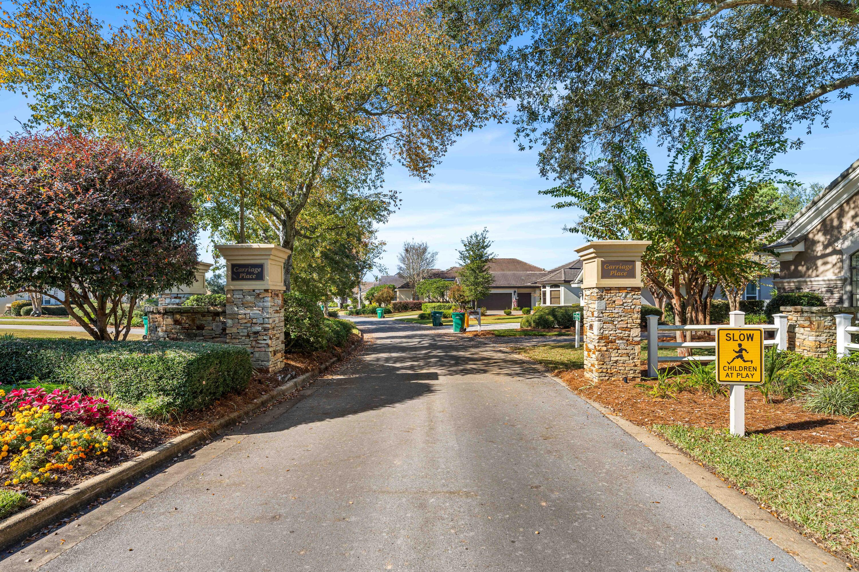 4345 Carriage Lane Destin, FL 32541 - Photo 36 of 39 a view of a street with houses a street and trees