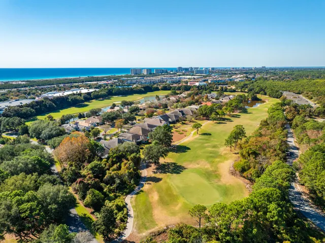 an aerial view of residential building and lake