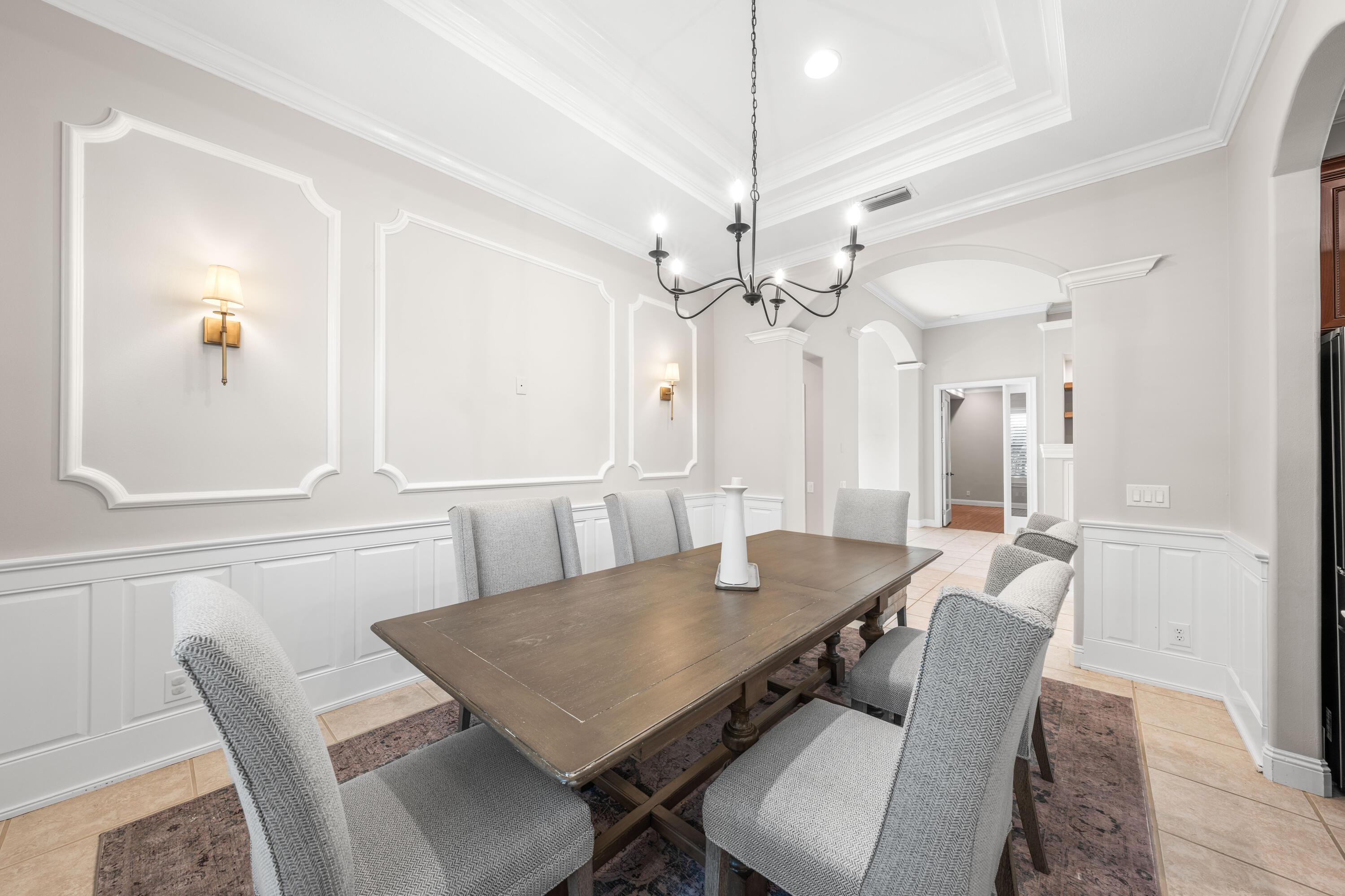 4345 Carriage Lane Destin, FL 32541 - Photo 6 of 39 a view of a dining room with furniture and a chandelier