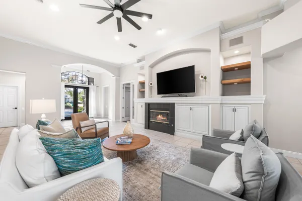 a living room with furniture and a flat screen tv