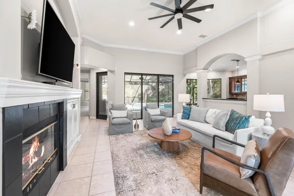 a living room with furniture fireplace and flat screen tv