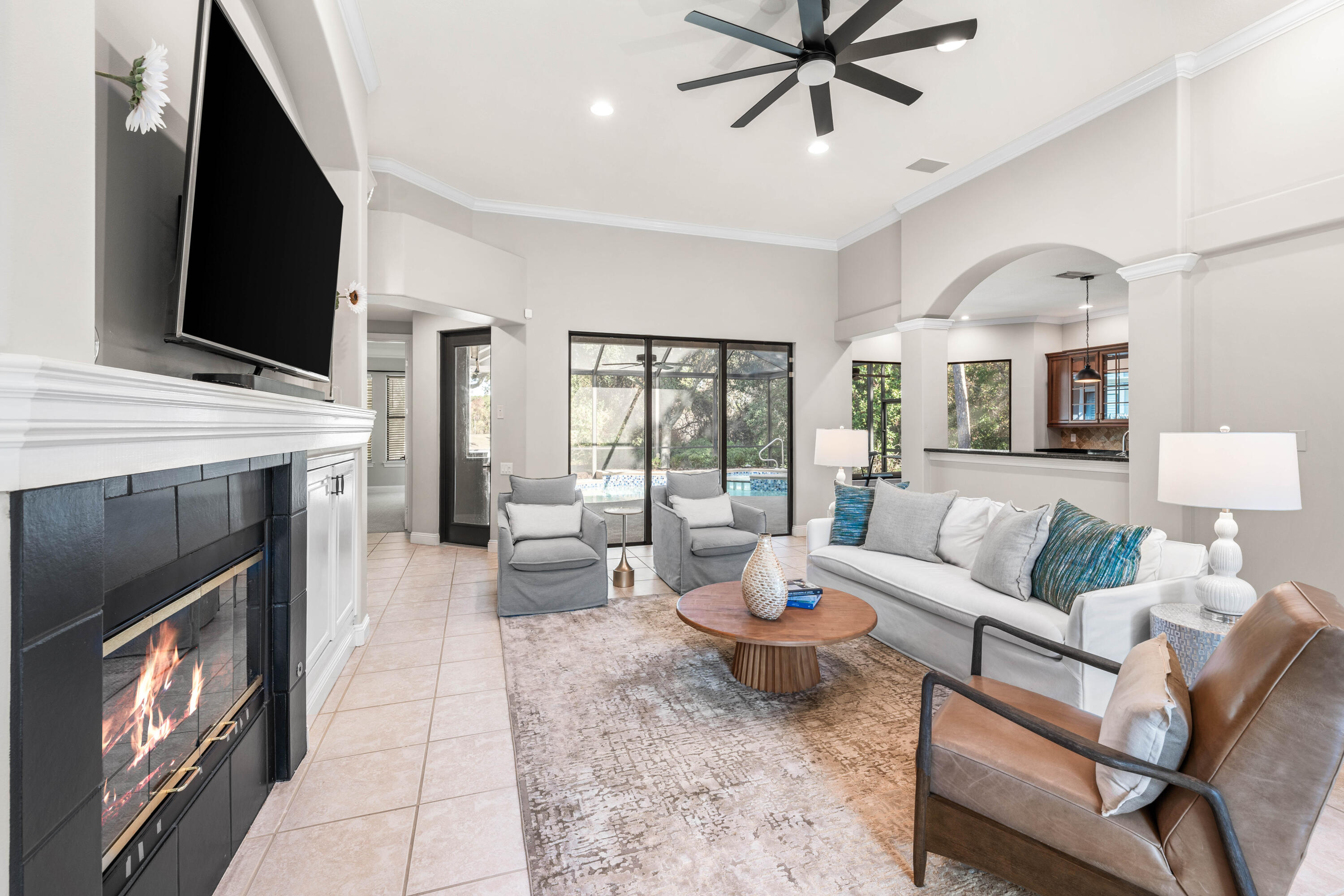 4345 Carriage Lane Destin, FL 32541 - Photo 10 of 39 a living room with furniture fireplace and flat screen tv