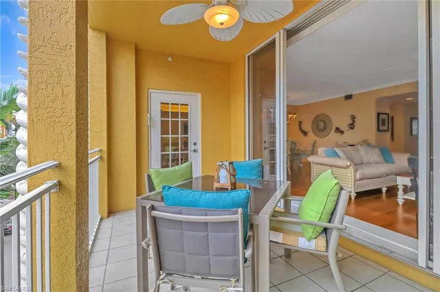 a view of a dining room with furniture and a window