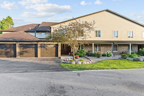 5000 Spinnaker Lane Crown Point, IN 46307 - Photo 1 of 23 a front view of a house with a garden and plants