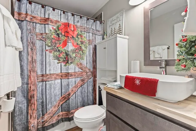 a bedroom with bed and a window