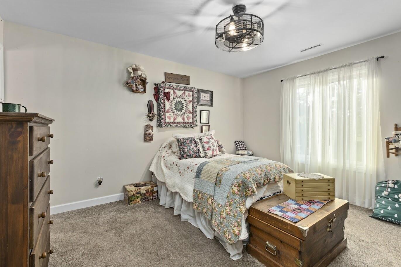 5000 Spinnaker Lane Crown Point, IN 46307 - Photo 13 of 23 a bedroom with bed and a window