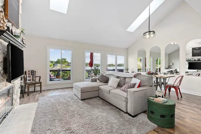 a living room with fireplace furniture and a flat screen tv