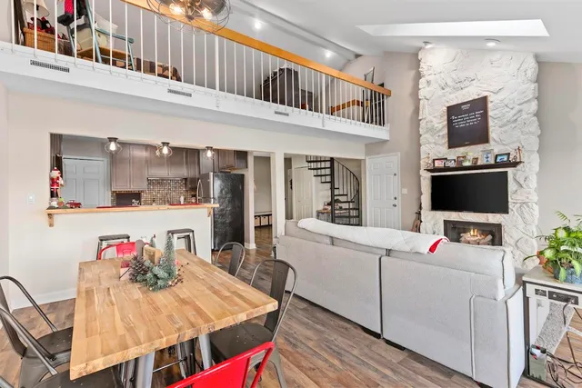 a living room with furniture and kitchen view