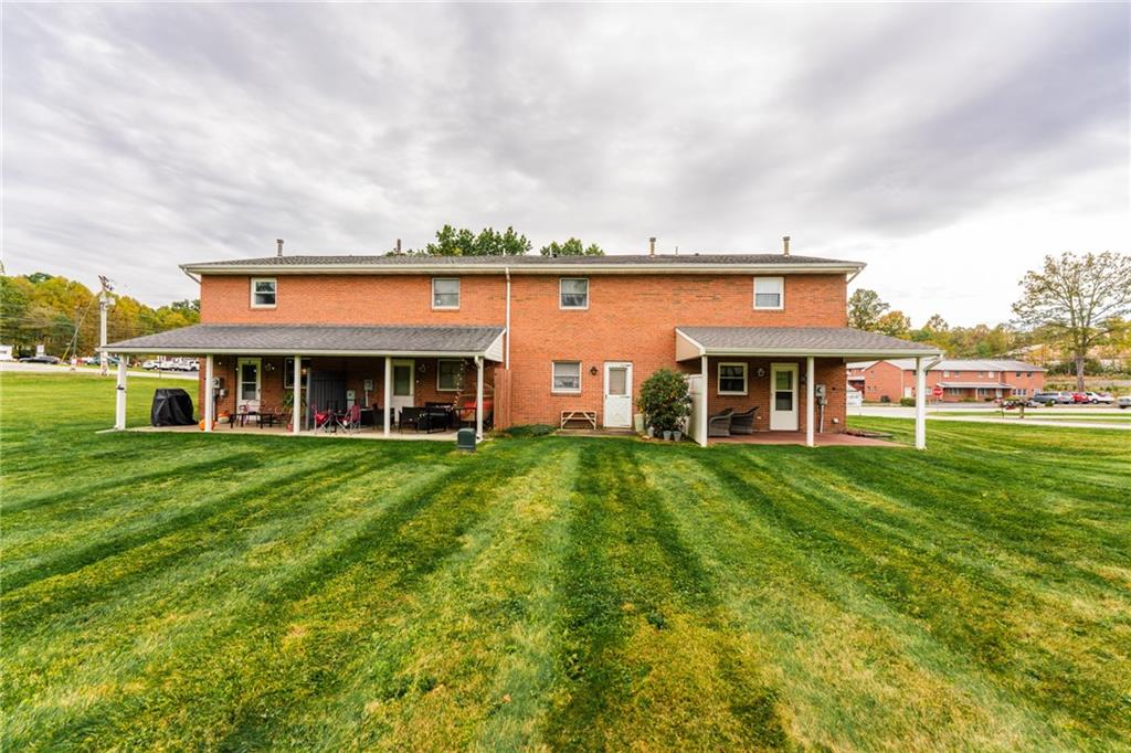 4903 Lucerne Road Indiana, PA 15701 - Photo 16 of 16 a view of a big house with a big yard and large trees
