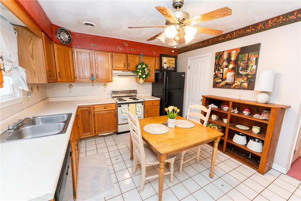 4903 Lucerne Road Indiana, PA 15701 - Photo 6 of 16 a kitchen with stainless steel appliances granite countertop a sink a stove and a refrigerator