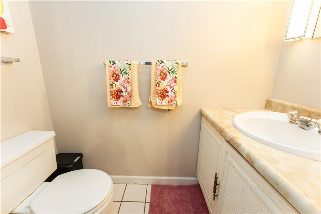 4903 Lucerne Road Indiana, PA 15701 - Photo 7 of 16 a bathroom with a granite countertop sink and a mirror