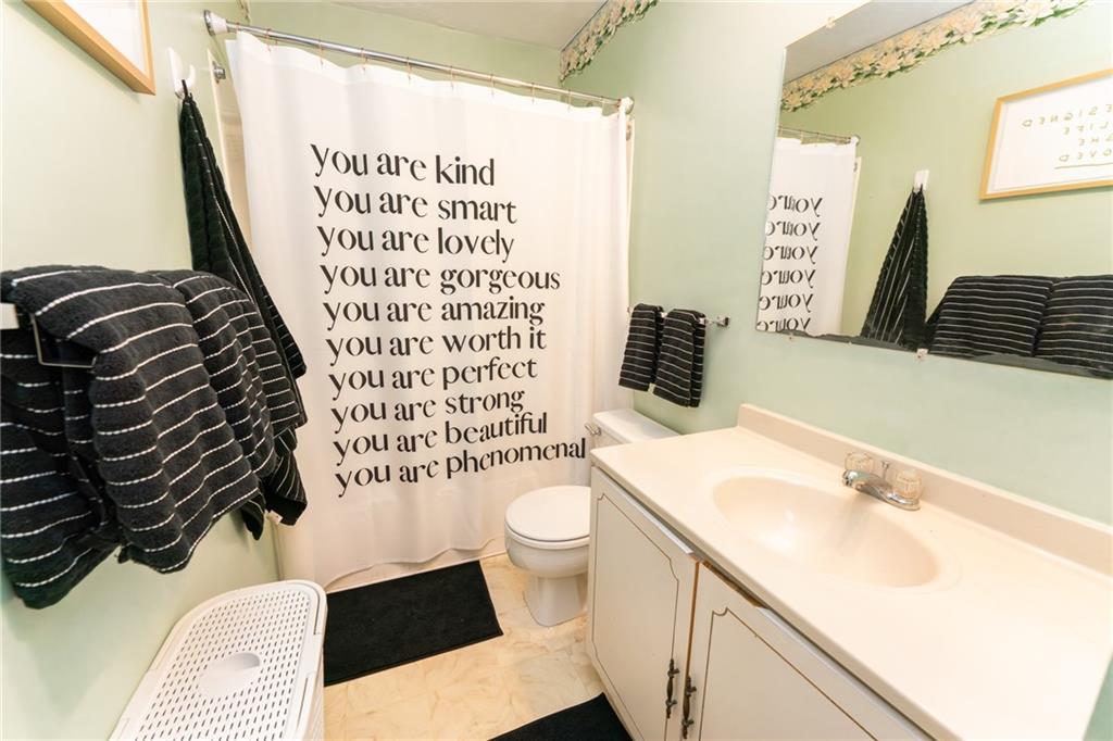 4903 Lucerne Road Indiana, PA 15701 - Photo 9 of 16 a bathroom with a sink a toilet and shower curtain