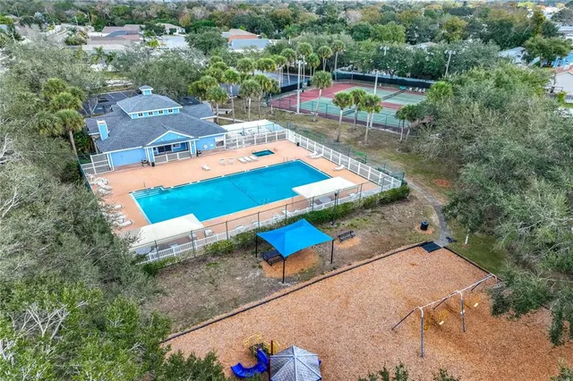 a view of a lake in between two of the trees